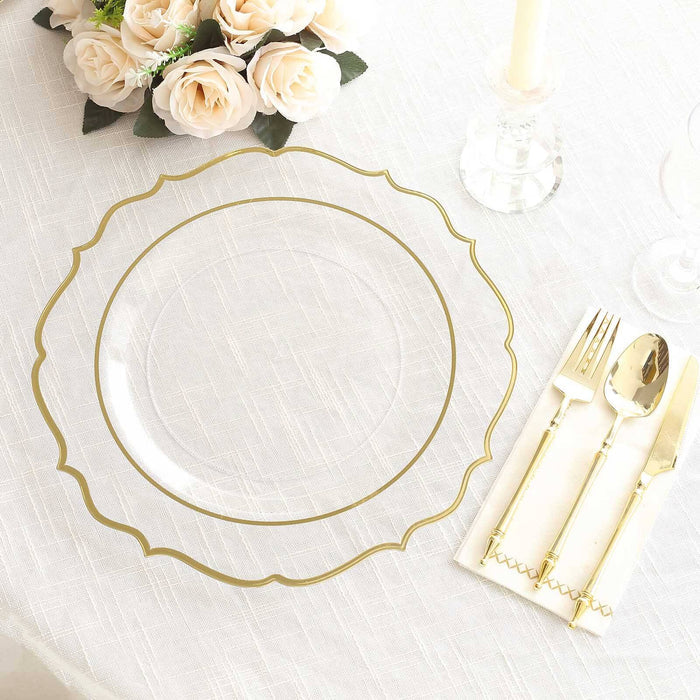 Clear decorative plate with gold trim set on elegant table setting.