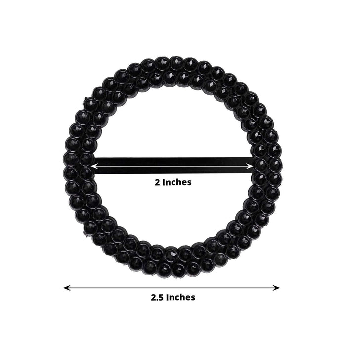 Black decorative beaded ring, 2.5 inches in diameter, 2 inches in width.