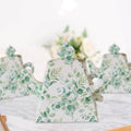 Floral-patterned teapot on a marble surface with blurred background