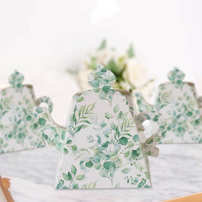 Floral-patterned teapot on a marble surface with blurred background