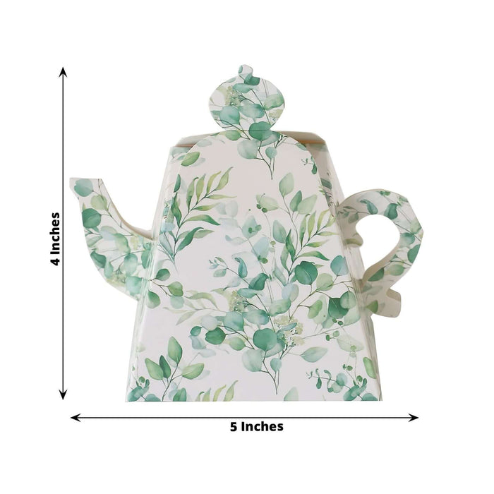 Floral tea kettle with green leaves design, 4 inches tall and 5 inches wide.