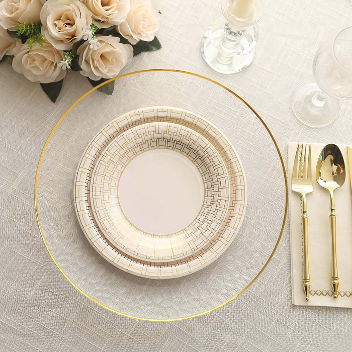 Elegant table setting with decorative plates and gold accents.