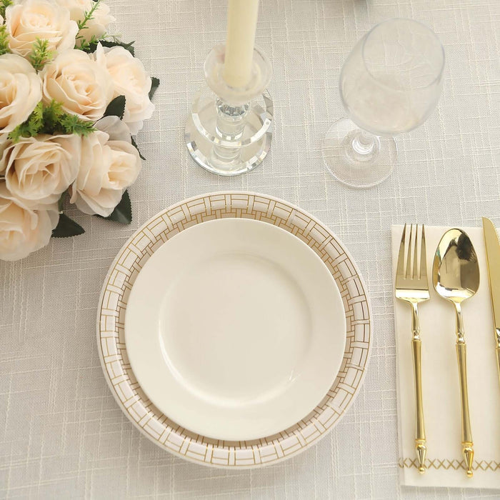 Elegant table setting with decorative plates, cutlery, and floral centerpiece.