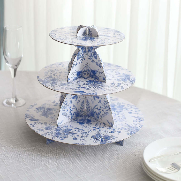 Three-tiered floral cake stand in blue and white design.