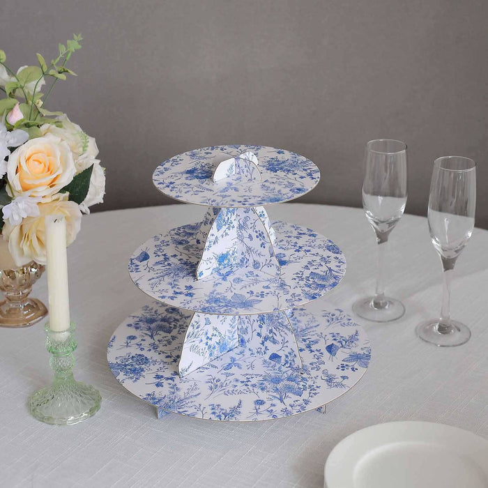 Three-tiered floral dessert stand with elegant design.