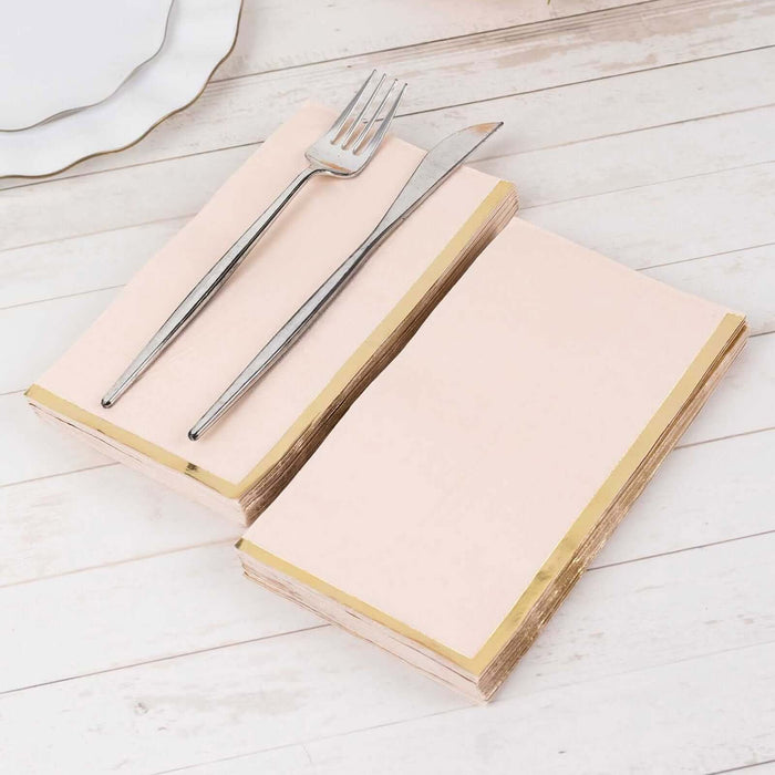 Elegant pink napkins with gold edges, styled with a fork and knife.