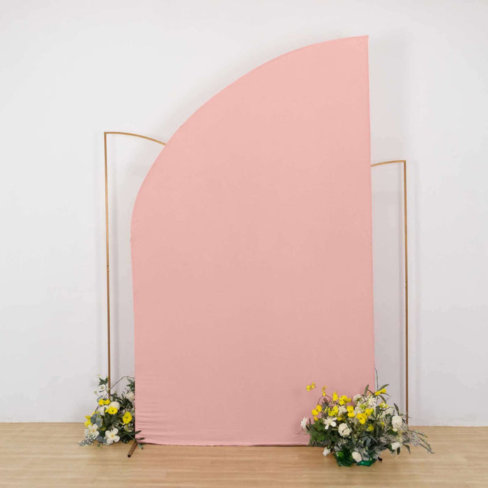 Pink fabric backdrop with floral arrangements at the base.