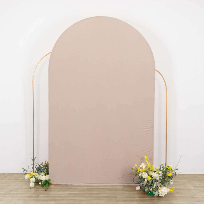 Neutral fabric backdrop with floral arrangements at the base.