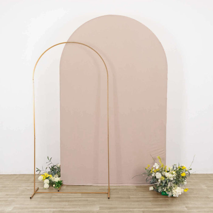 Minimalist wedding backdrop with floral arrangements and arch.