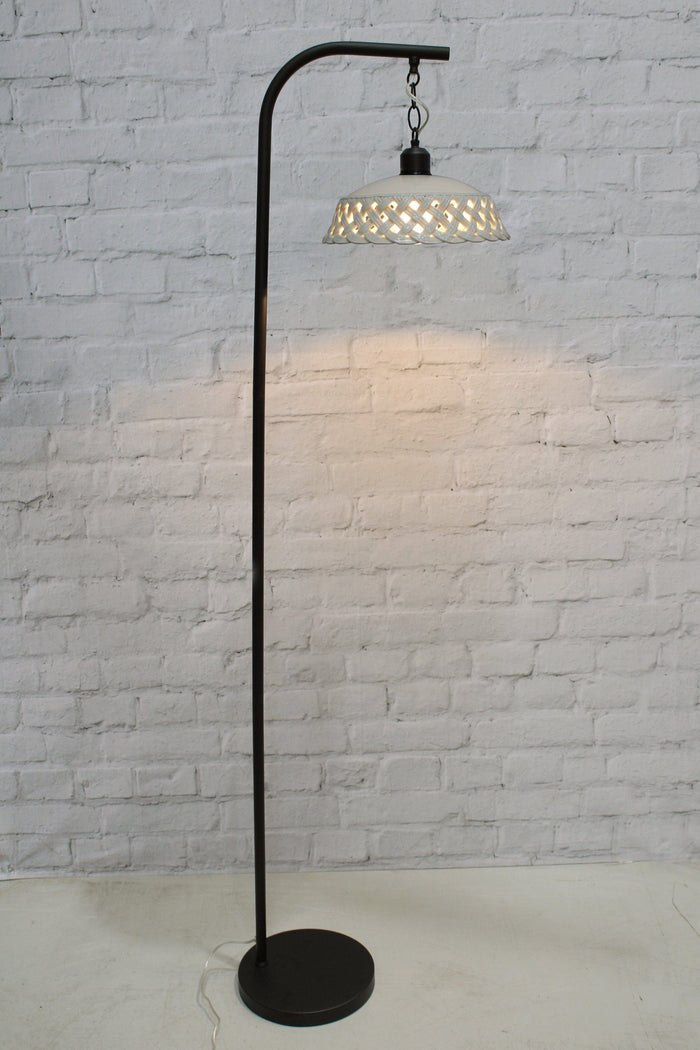 Ceramic floor lamp with black base.