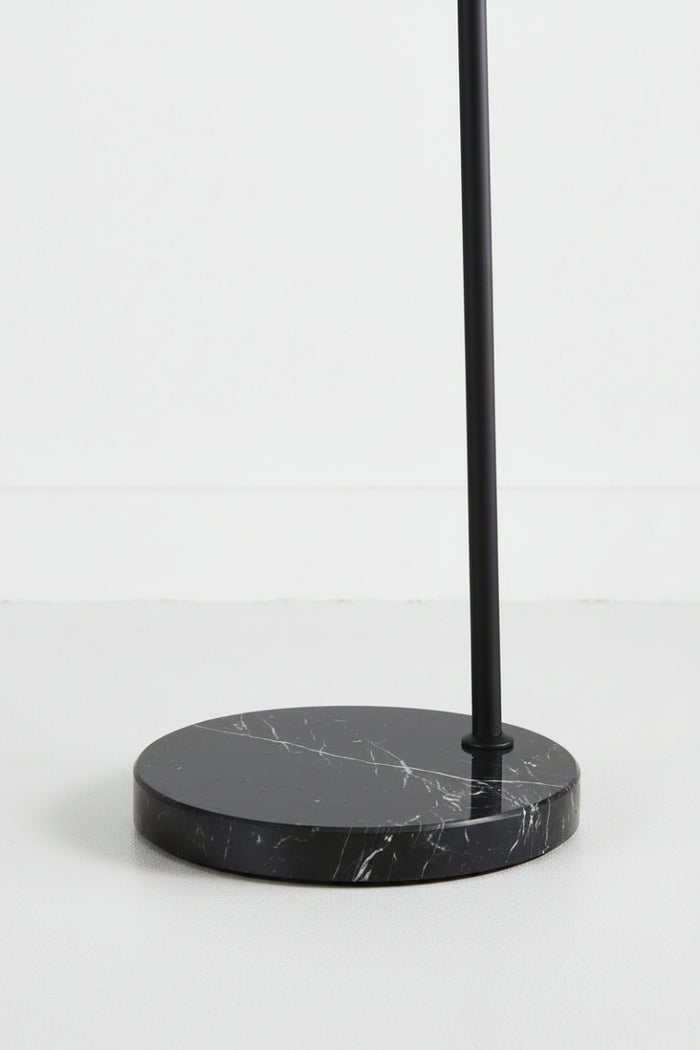 Close-up of the black marble base and black floor lalmp stem.