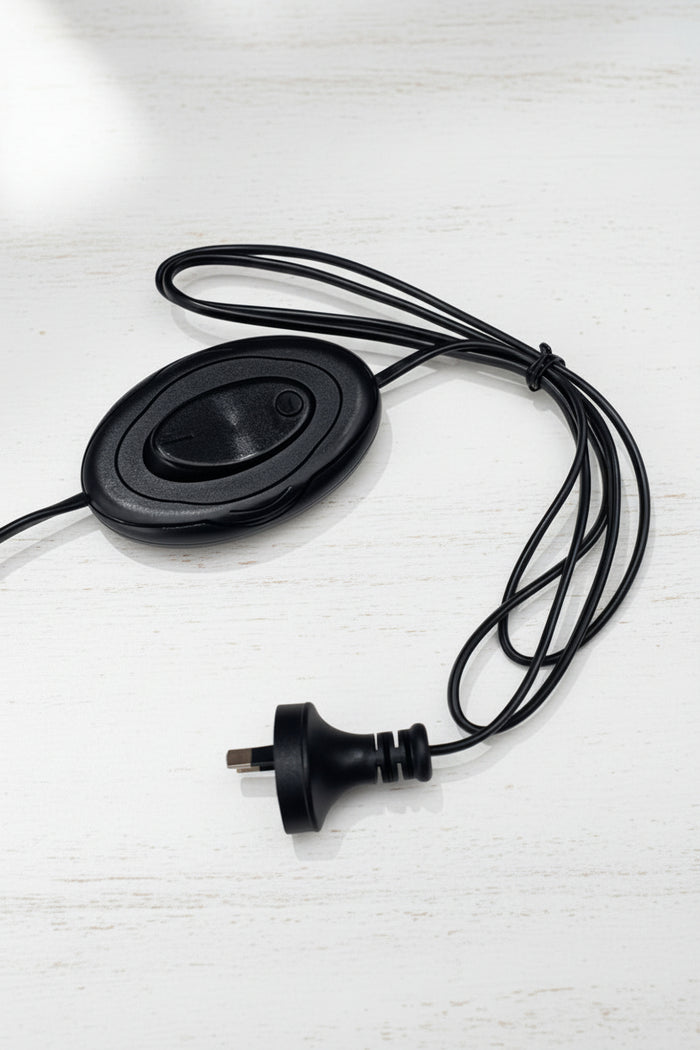 Close up of the black ower cord and inline foot switch.