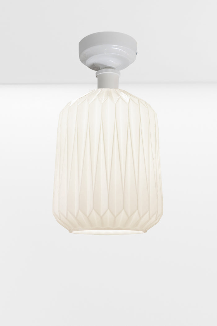 Modern geometric detailed opal glass shade, paired with a white batten holder.