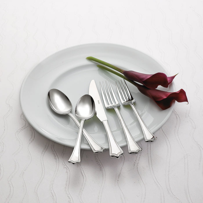 Arcoroc FK702 Amaryllis 8 1/4" 18/0 Stainless Steel Solid Handle Heavy Weight Dinner Spoon by Arc Cardinal - 12/Pack