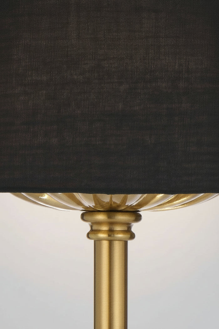 Close up of the antique gold table lamp stand with black fabric shade.
