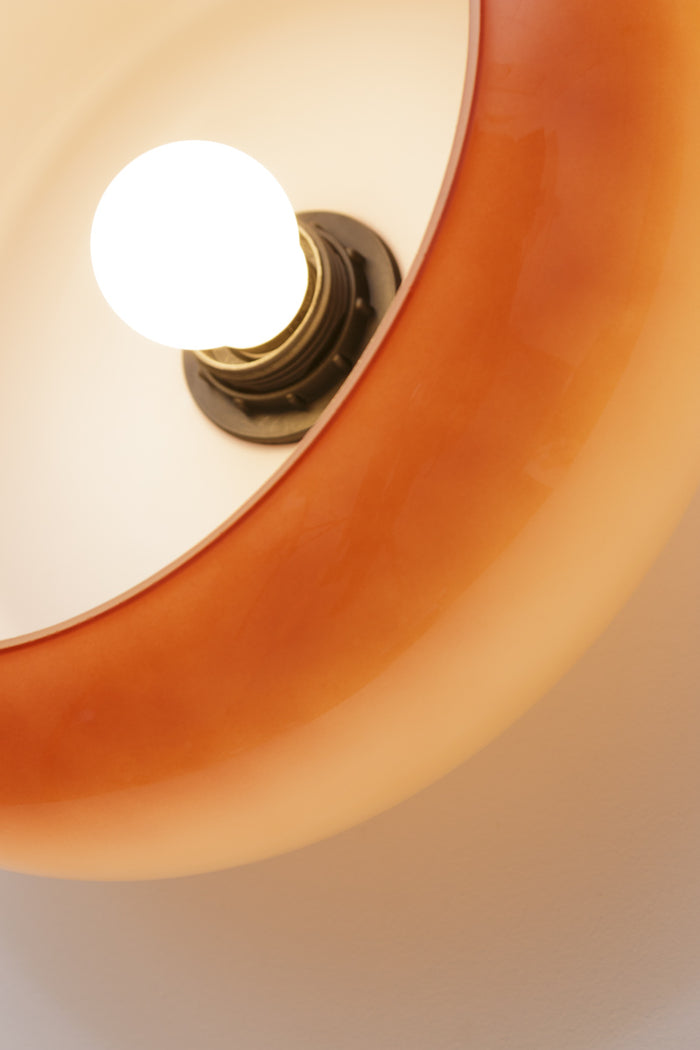 The handmade blown glass shade in brown