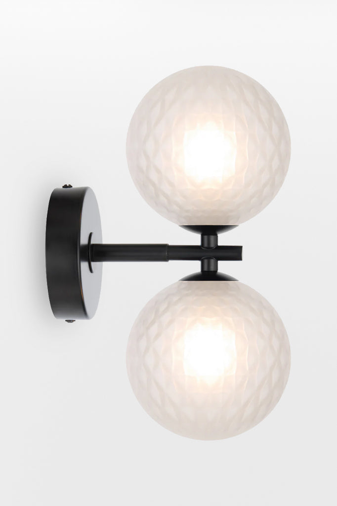 Black double up/down lampholder wall light with opal tear finish.