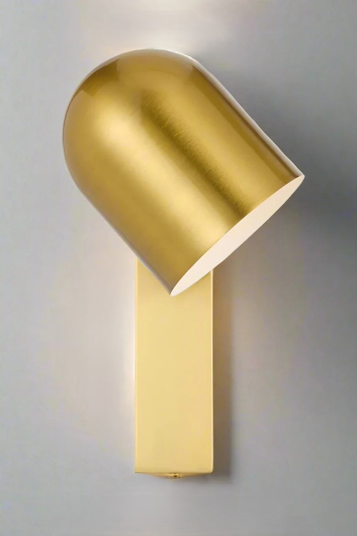 Antique gold touch wall light showing swival shade.