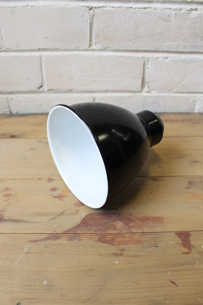 Brasserie enamel coated shade in black with white inner.