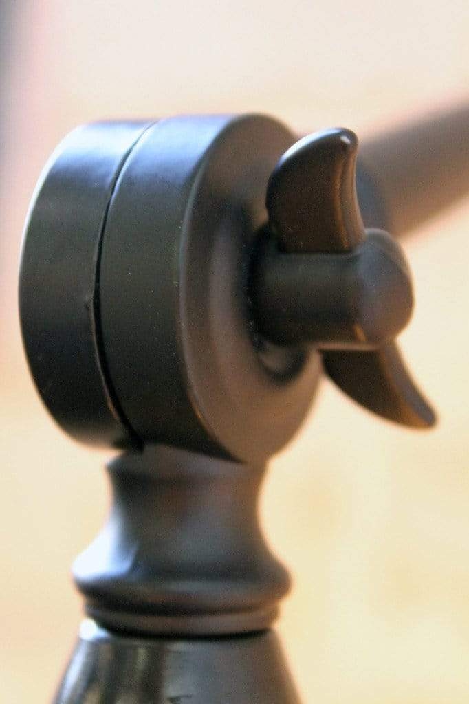 Two arm swing wall lamp does not require tools to lock into place.