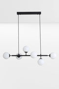 Black 6 light linear glass ball pendant light.