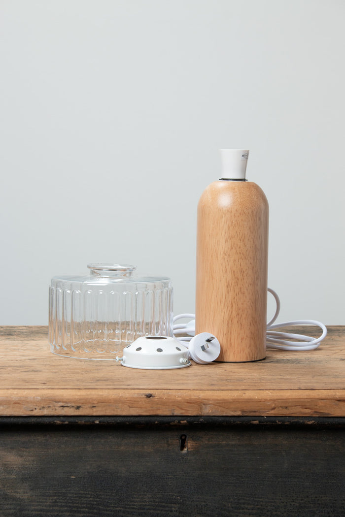 Capri Wood Table Lamp with natural timber base styled on a wooden console table