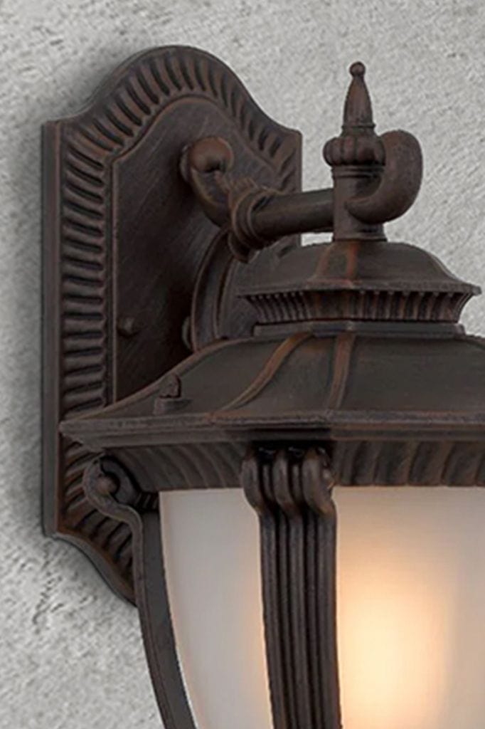 Close-up of outdoor wall light in antique bronze finish.