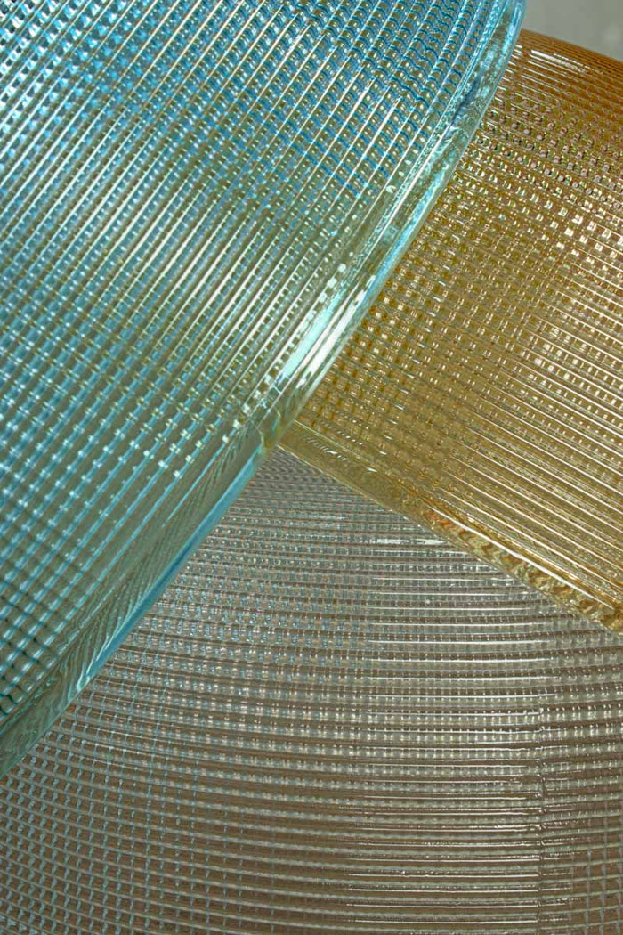 Close up of the holophane glass shades in blue, amber and clear.