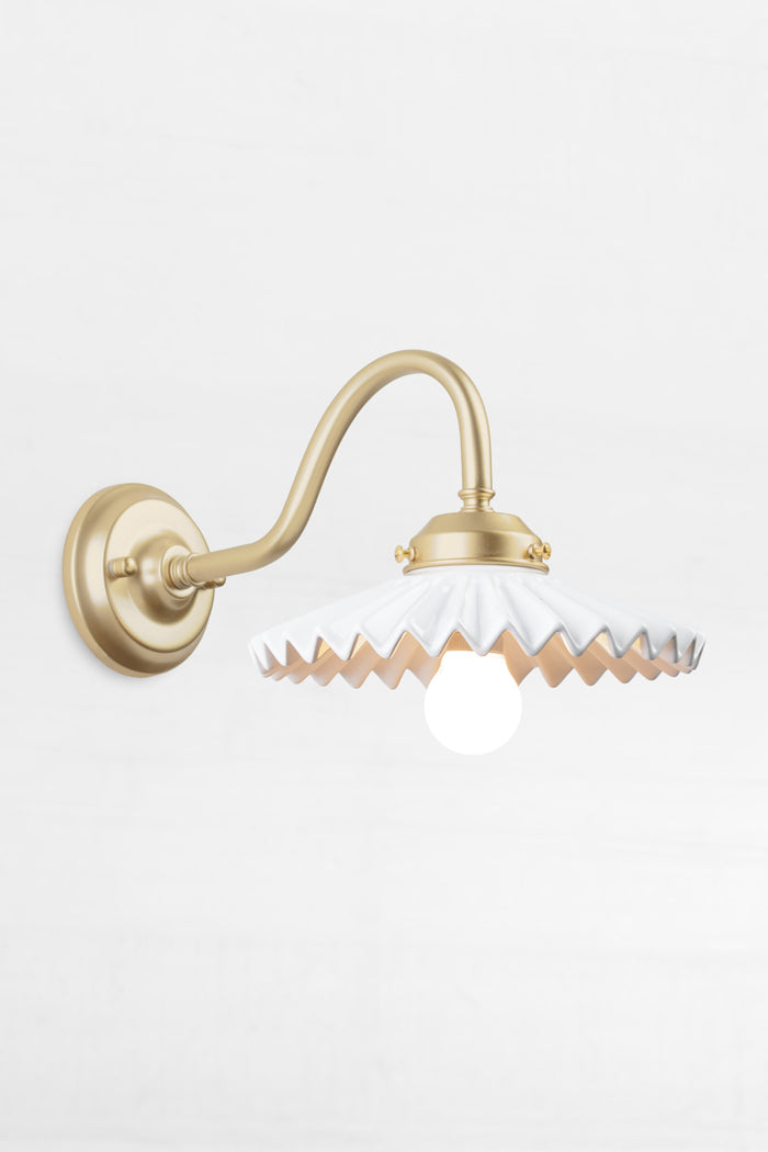 Gold/brass gooseneck wall arm with an integrated 2 and 1/4 cup, paired with a white ceramic shade.