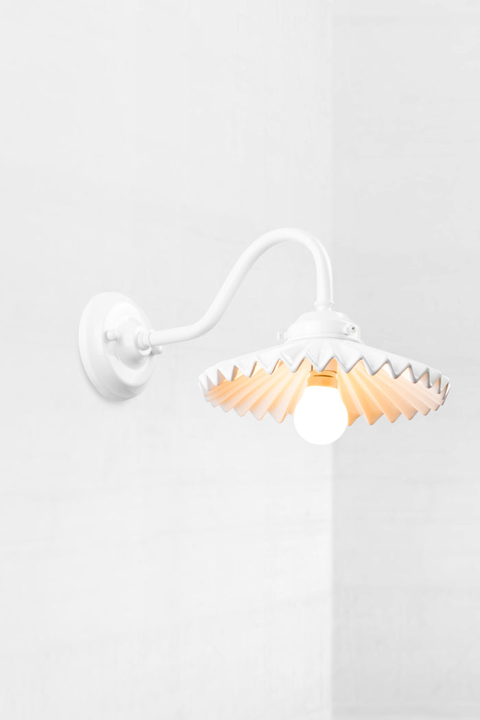 White gooseneck wall arm with an integrated 2 and 1/4 cup, paired with a white ceramic shade.