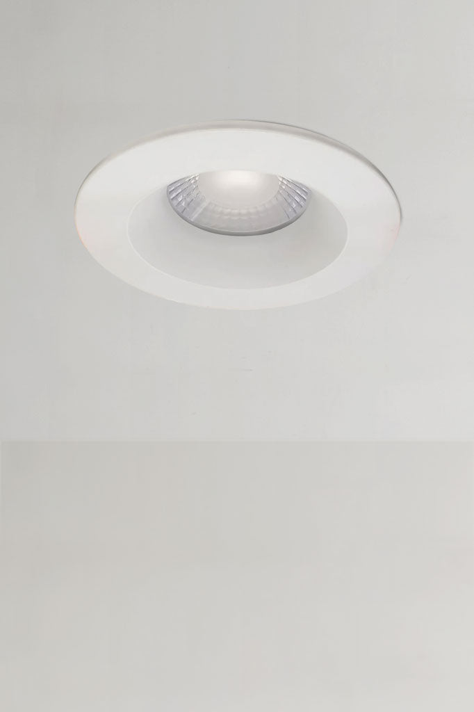 Installed white fixed downlight.
