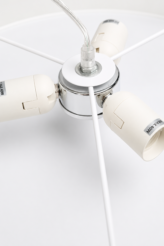 Close-up of the Clemente pendant light ceiling canopy with white fabric cord and white lampholder assembly.