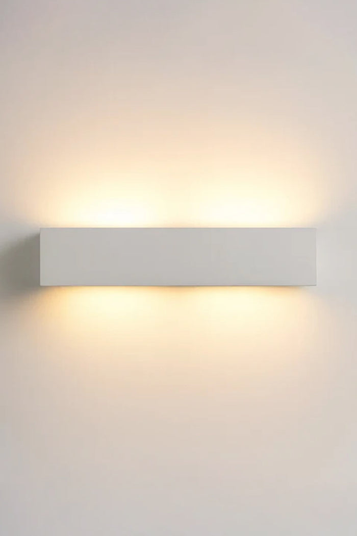 Collaroy Plaster Wall Sconce medium size illuminated with concealed up and down lighting.