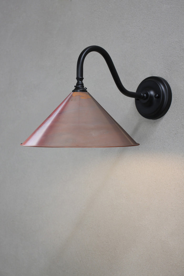 Black steel sconce with aged copper shade