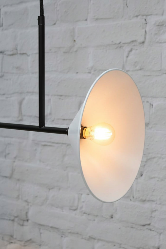 Cone Junction Light in black with white steel cone shades.