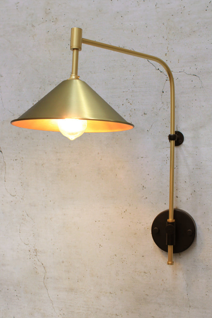 gold arm with bright brass shade