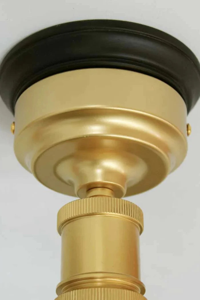 batten holders in gold/brass, on black wooden block