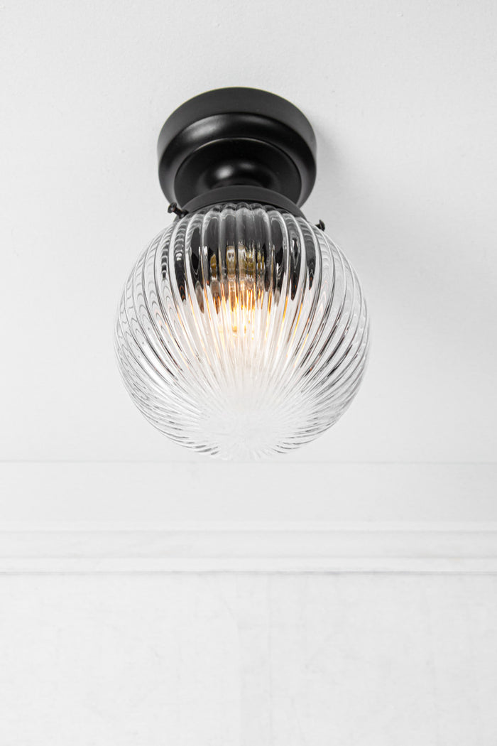 Clear reeded glass ball batten light with black metalware