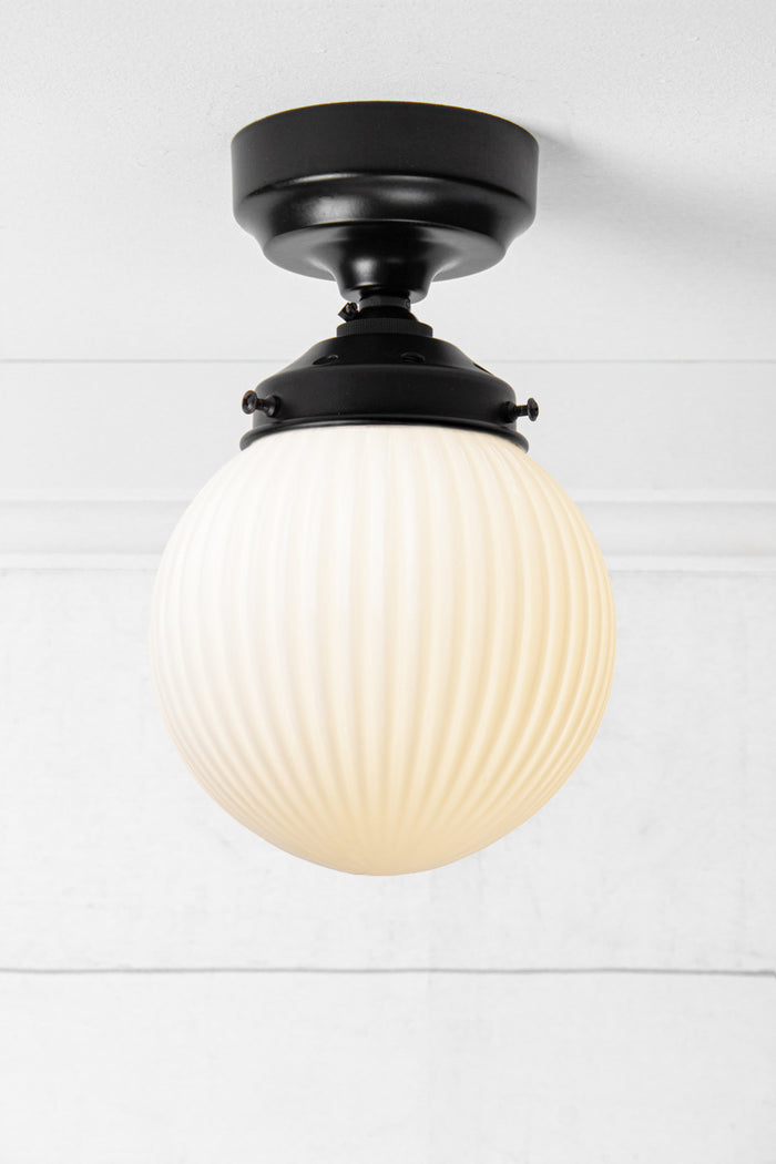 Opal reeded glass ball batten light with black metalware