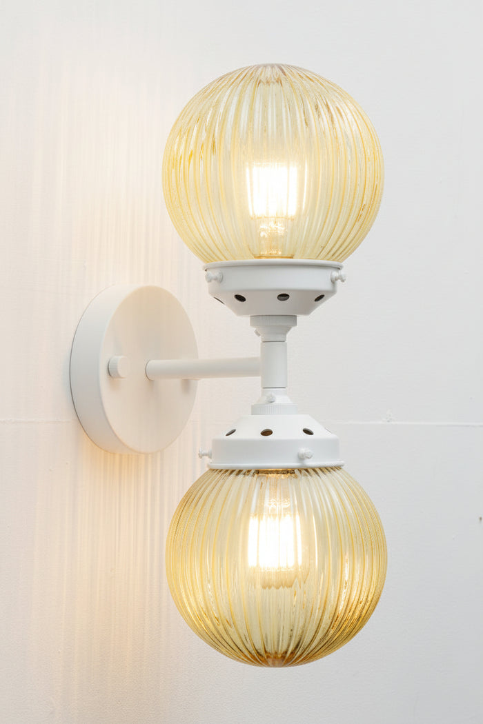 Dakota Reeded Glass Double Light Wall Sconce in white with amber shades
