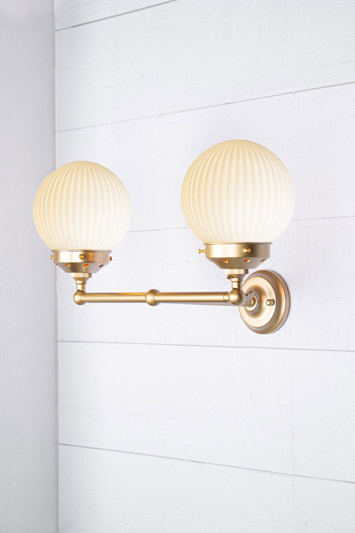 Opal shades with gold/brass double arm sconce