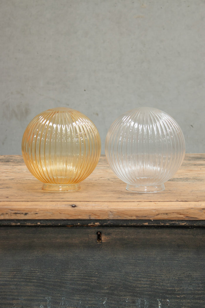 Reeded glass ball shades in clear and amber