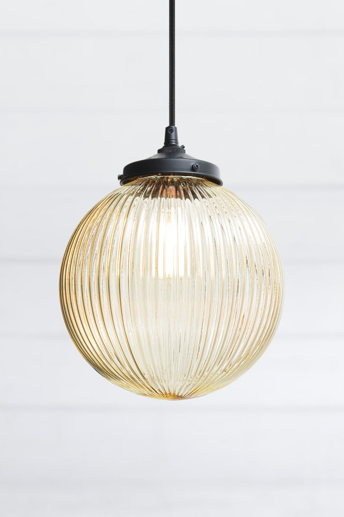 Dakota Reeded Glass Pendant Light medium amber glass on black cord