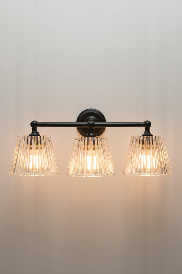 Black Davis Glass Triple Swivel Arm Wall Light with three tapered clear fluted glass shades