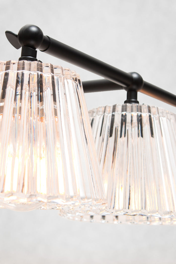 Close-up of Davis Glass Triple Swivel Arm Wall Light with clear vertically fluted glass shades