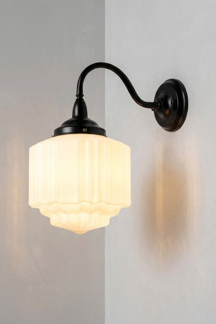 Deco Glass Exterior Wall Light with opal glass shade on black curved wall arm