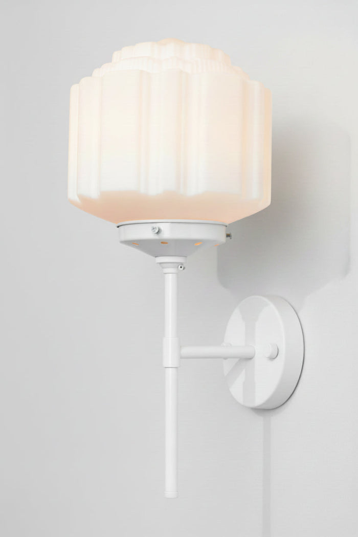 White steel stem wall sconce and an opal glass deco shade