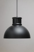 Matt black industrial dome pendant light with smooth metal shade shown unlit on a neutral background.