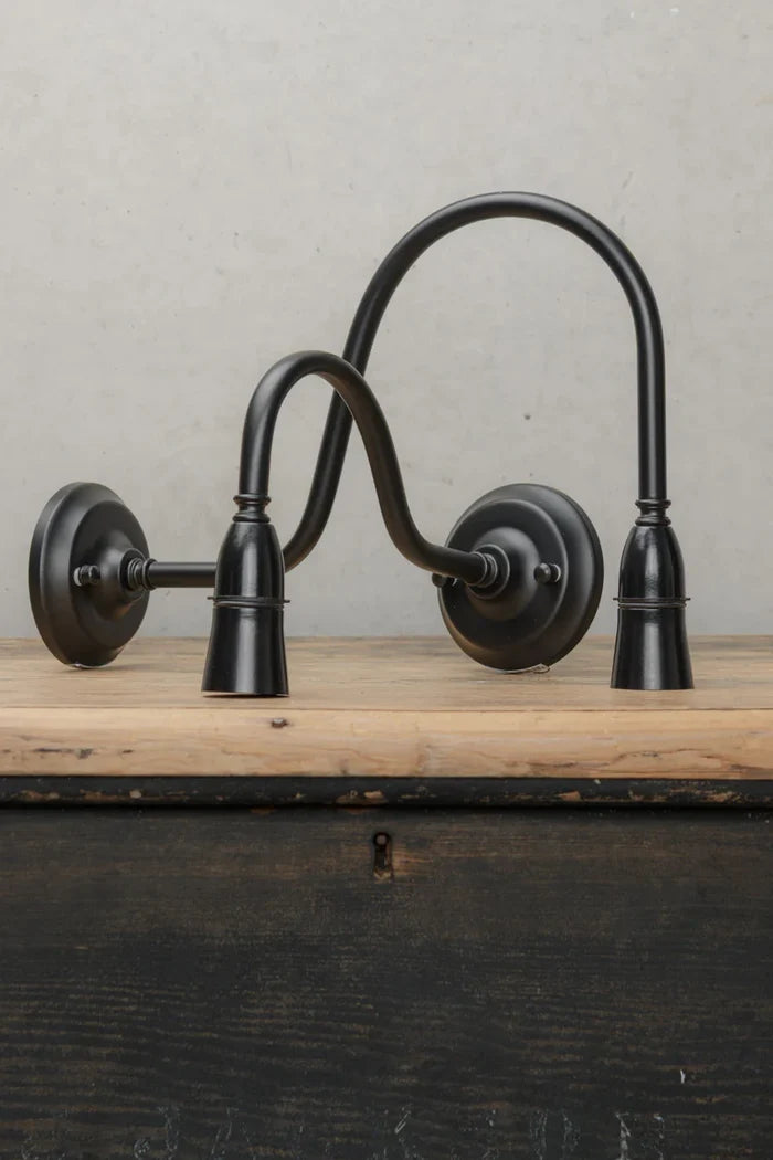 Small and large black, steel, gooseneck outdoor wall sconce.