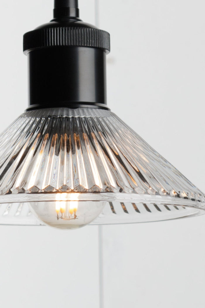Close up of the Florence reeded glass shade on black lampholder.